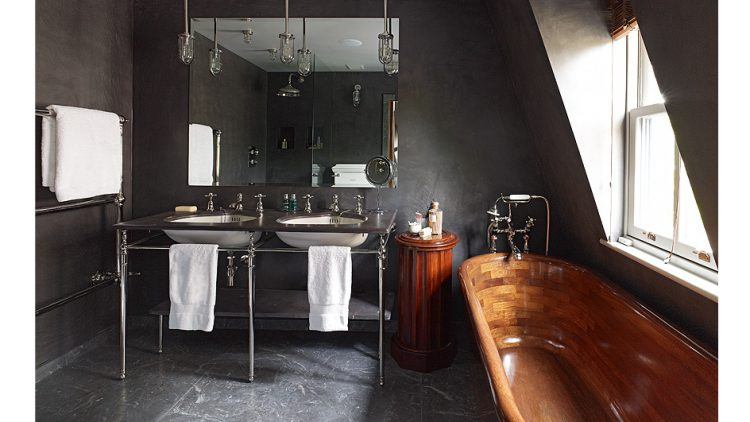 gray bathroom with wood tub