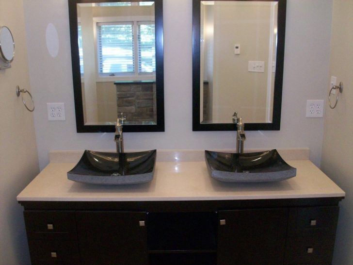 bathroom with black vessels 