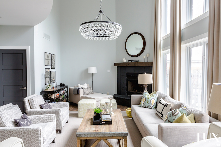 light colored living space with chandelier 