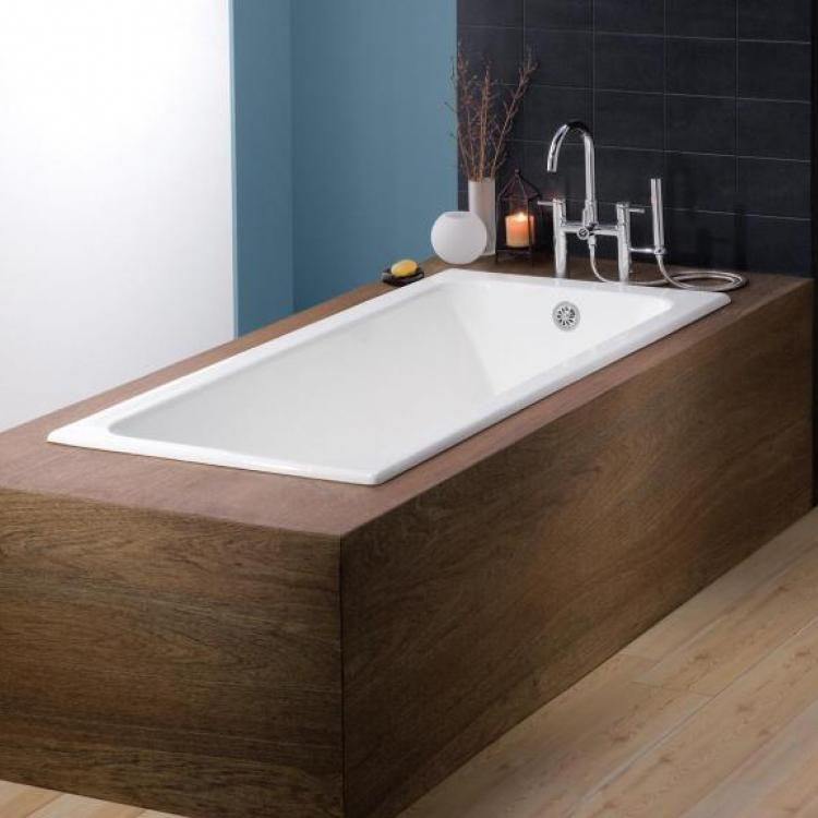 beautiful drop in bath tub with wooden edges