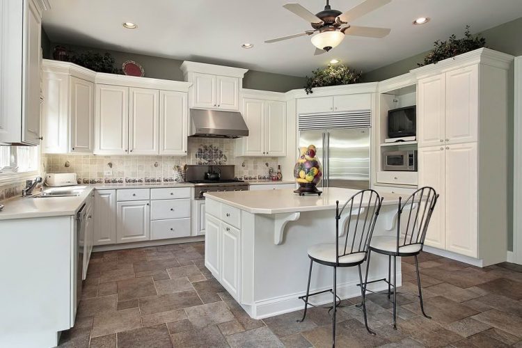 modern all white kitchen with tile flooring