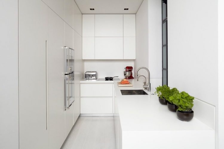 clean all white kitchen with faucet