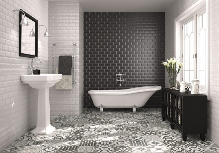 bathroom with black tile accent wall