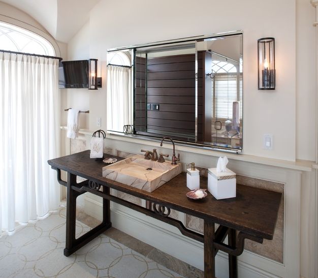 bathroom with wooden table vanity