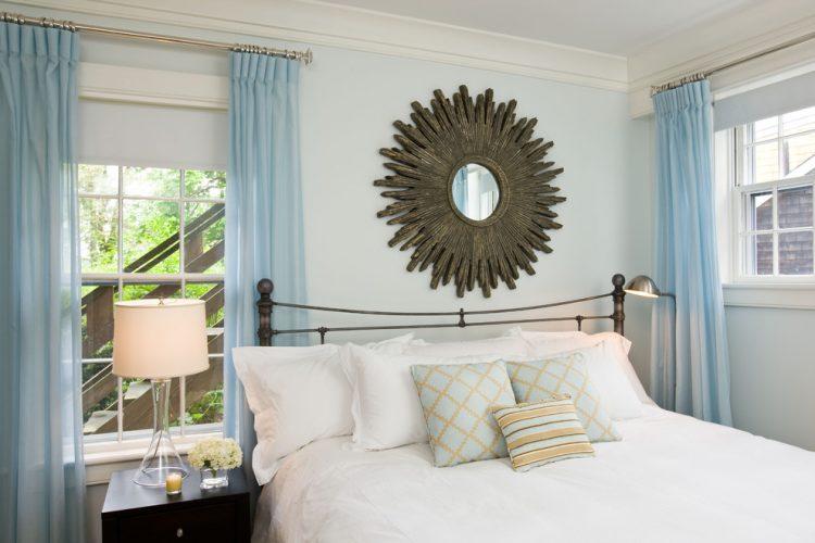 bedroom with crown molding and wood window trim