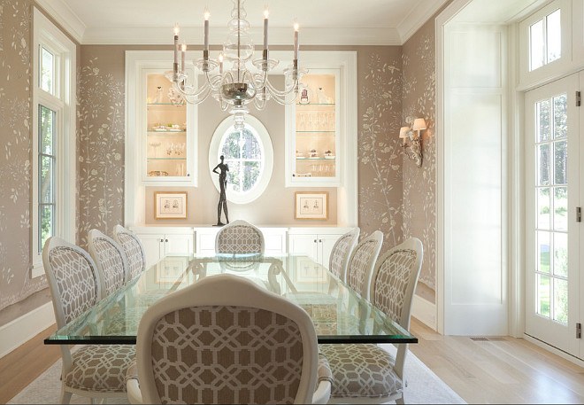 formal dining room with gold wallpaper