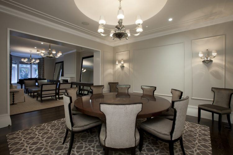 contemporary dining room with round wooden table