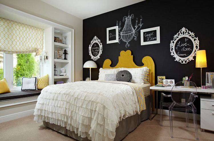 bedroom with black accent wall with chalk