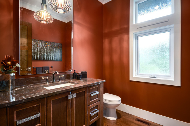 bathroom with orange/red walls