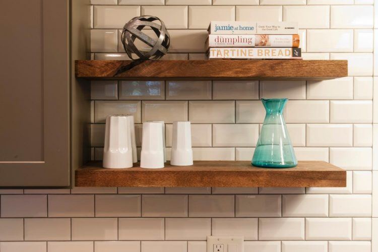 wooden shelving with subway tile backsplash