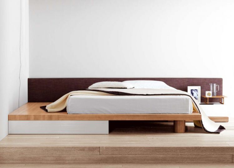 bed on wooden platform 