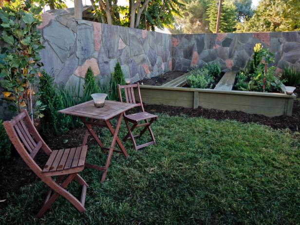 small backyard design with brick wall