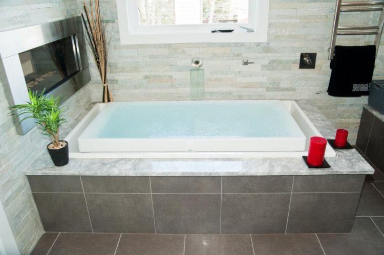 overflowing infinity tub with tile