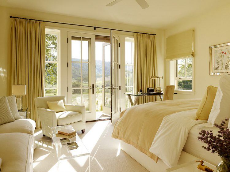 yellow walls bedroom with brown furniture