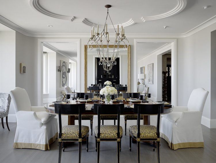 lavish dining room with gold mirror