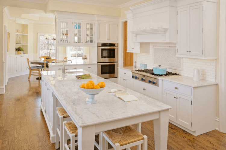 white-kitchen-island-with-wicker-stools