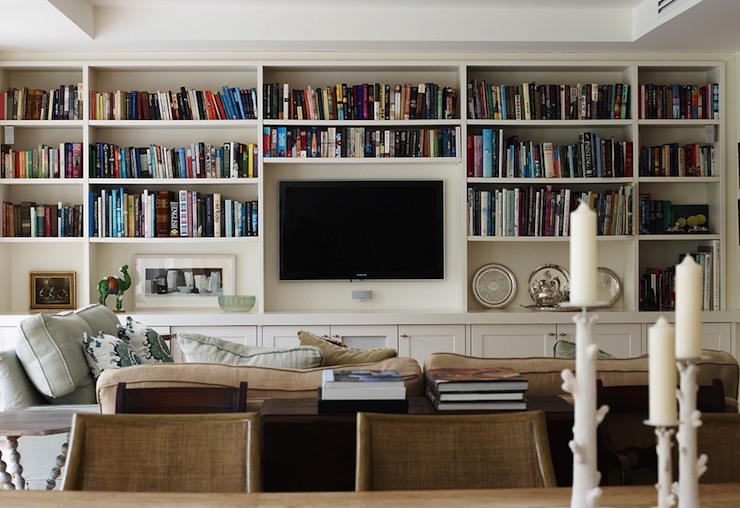 living room with lots of book shelves