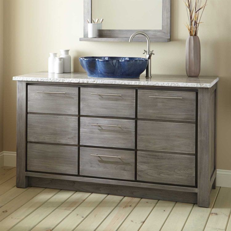 bathroom with blue vessel sink