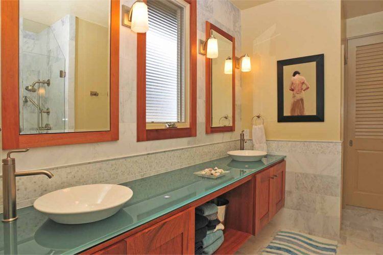 remodeled bathroom with glass counter