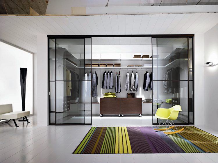 modern closet with glass sliding door