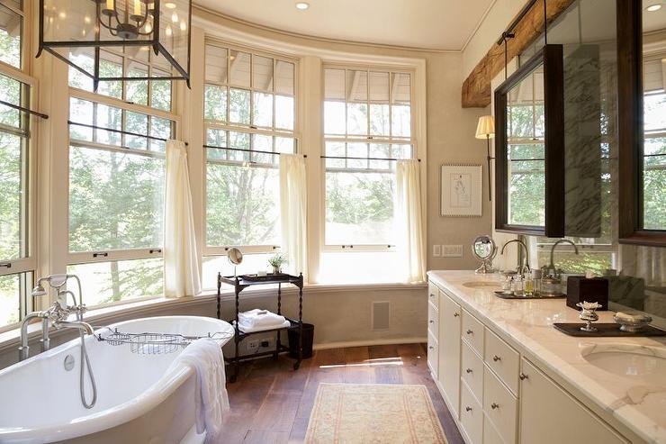 master bedroom with bay windows