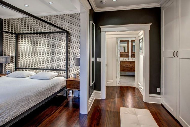 contemporary master bedroom with canopy bed