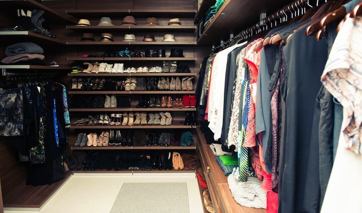 closet with long wooden shelves