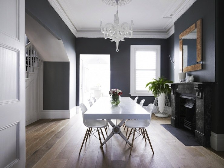 simple lavish formal dining room with white table