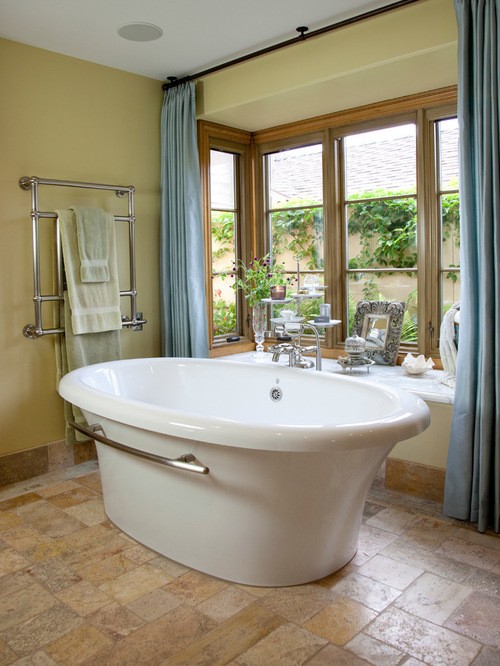 traditional bathroom with freestanding tub and great view