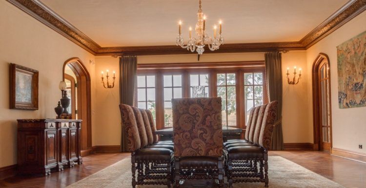 dining room with gold crown molding