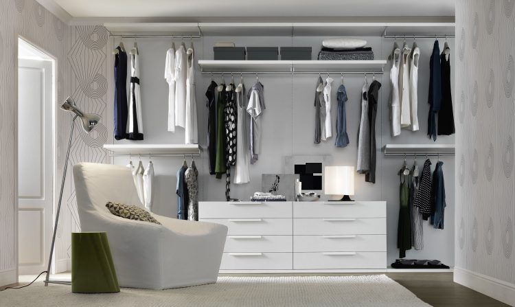 all white closet with floating shelving