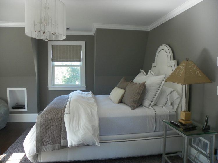 gray bedroom with traditional chandelier 