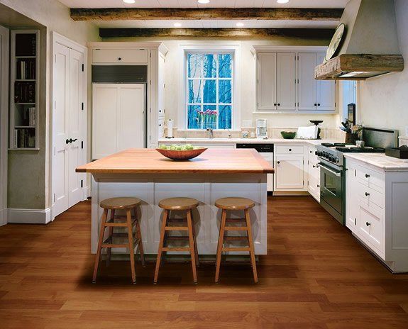 small kitchen with island with wooden countertop