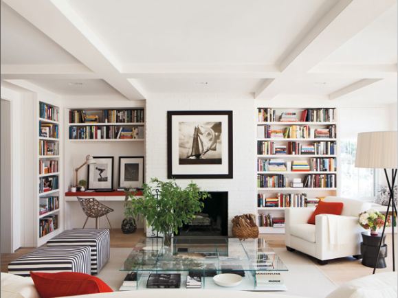 living room with built in shelving and accent pillows