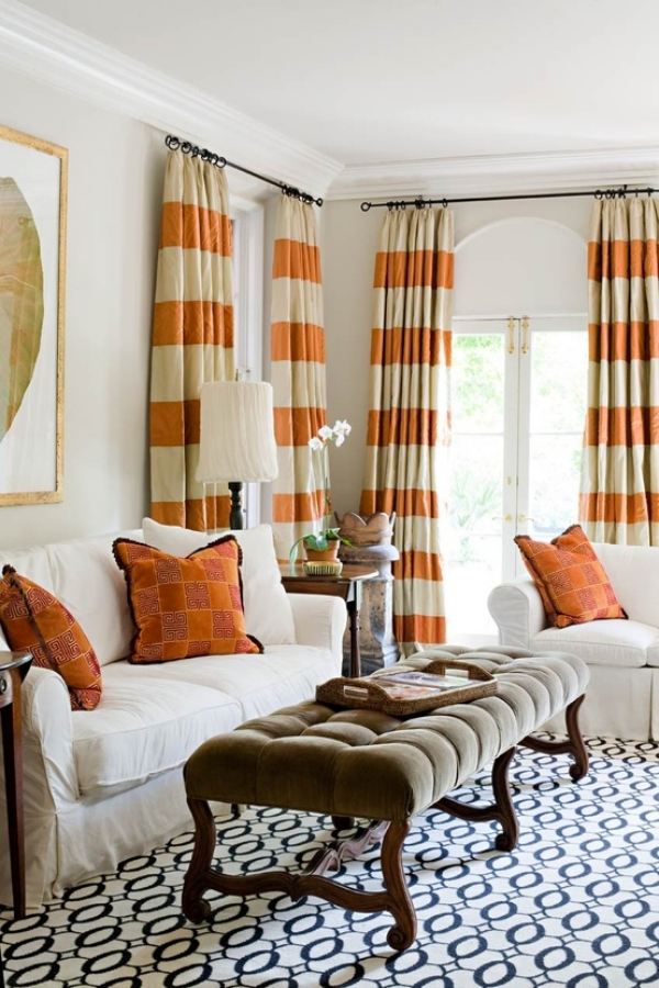 living room with orange striped curtains