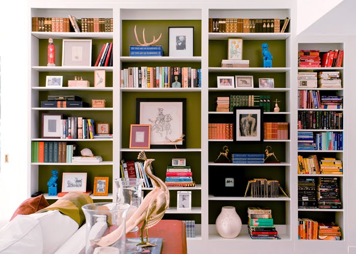 living room with extra shelving and green accent