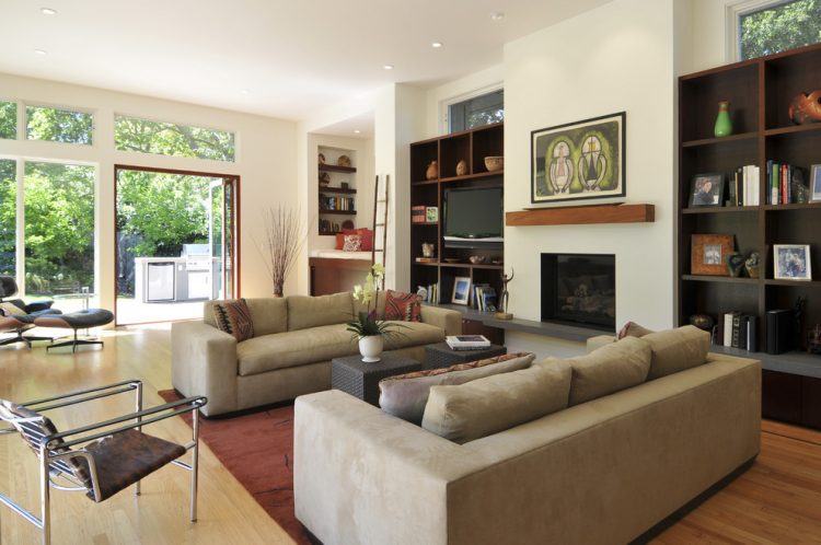 beautiful living room with wooden built-in shelving