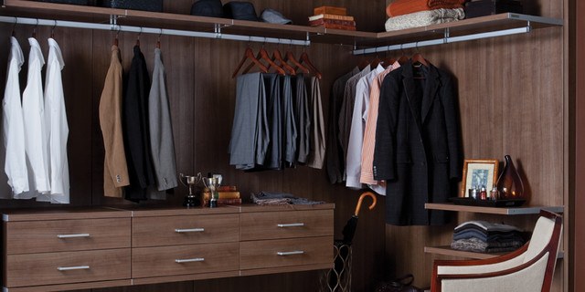 modern closet with floating shelving made of wood