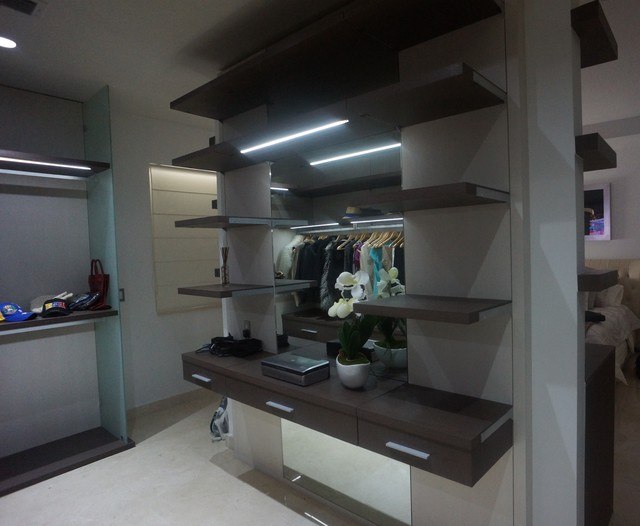 modern closet with floating shelving