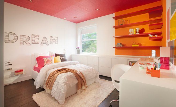 teen bedroom with orange accent shelves