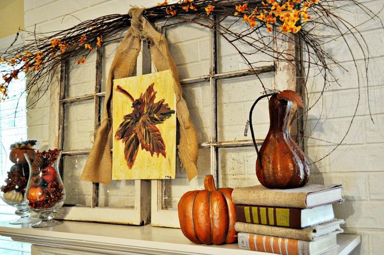 modern living room with fall themed mantel decorations