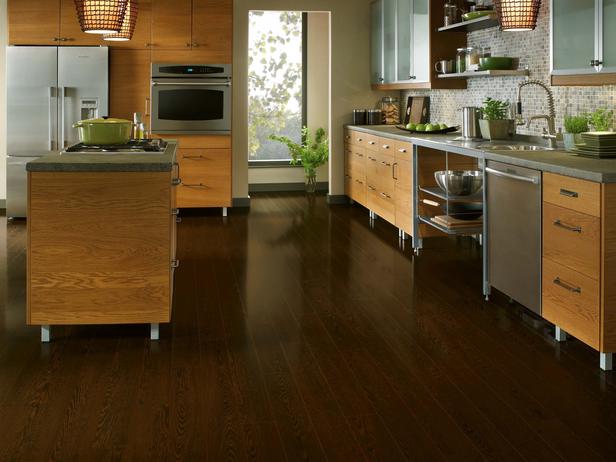 sleek contemporary kitchen with dark laminate flooring