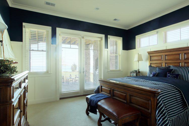 large bedroom with blue and white paint