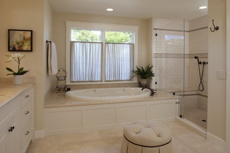 oval drop in bath tub in traditional bathroom