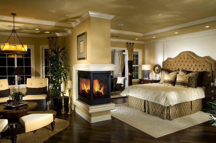 large bedroom with fireplace and sitting area