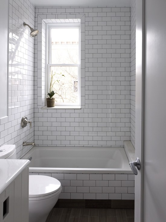 bathroom with tiled bath tub