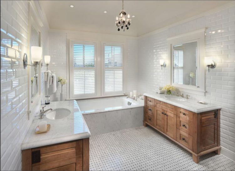 all-white bathroom with wooden vanity