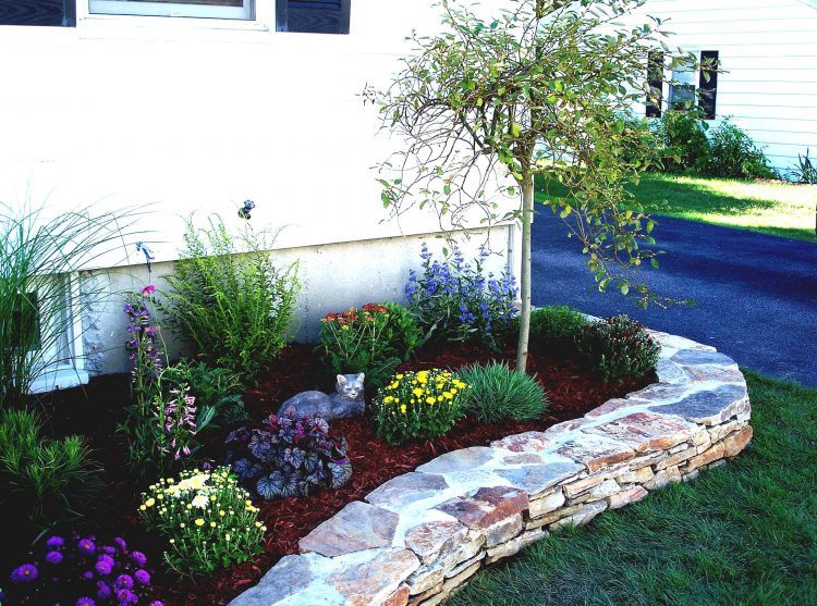 simple flower bed on side of home