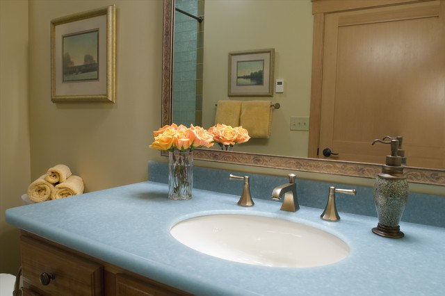 traditional bathroom with blue glass counter