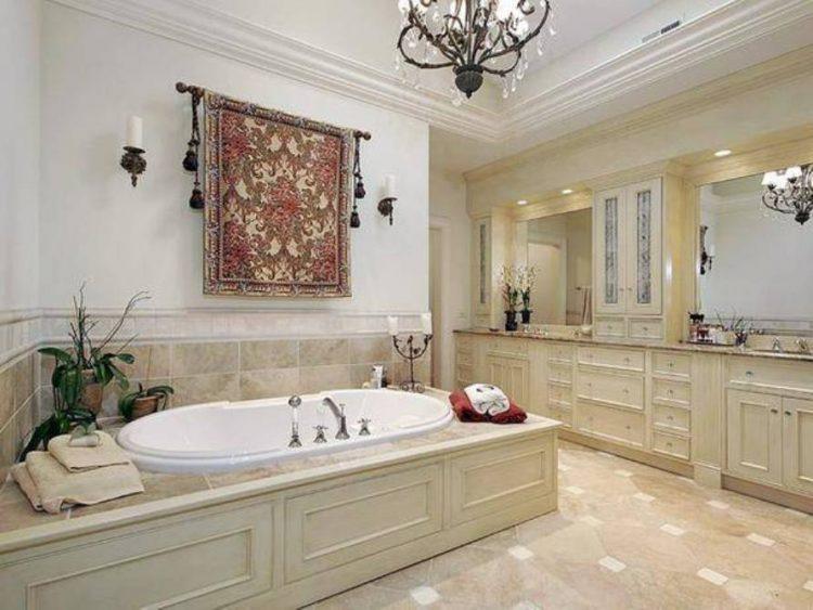 https://housely.com/wp-content/uploads/2016/09/traditional-bathroom-designs-with-chandelier-and-vanities-and-drop-in-tub-and-moroccan-fabric-decor-and-sconces-750x563.jpg